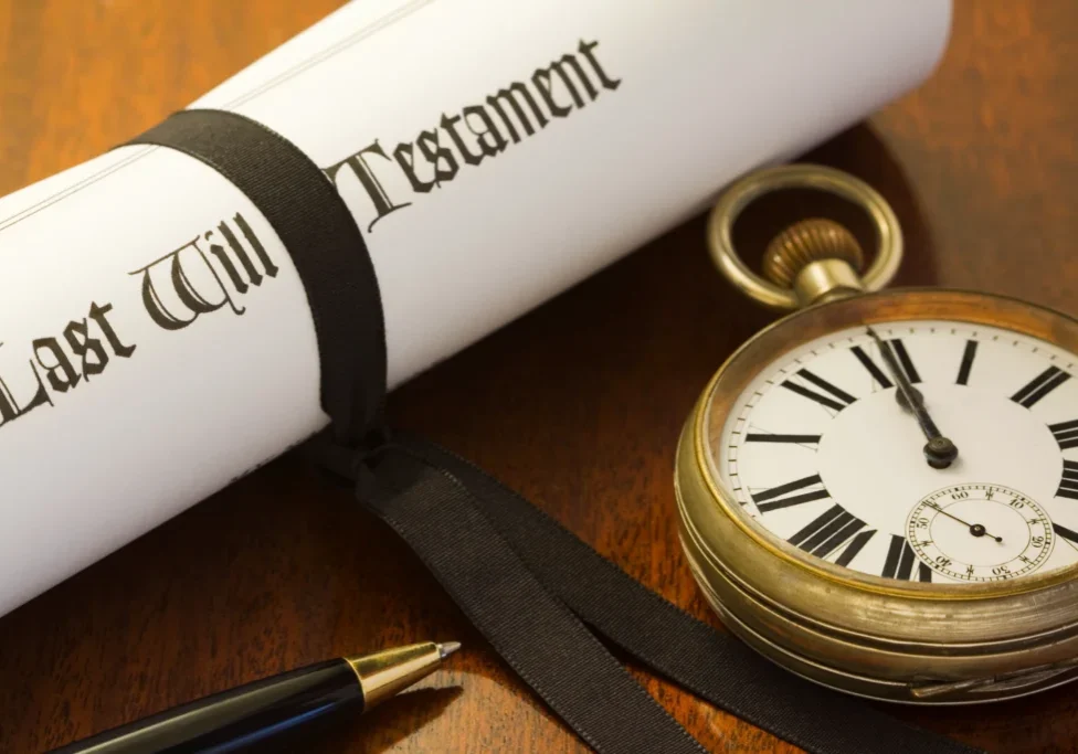 Last will, pocket watch, and pen.
