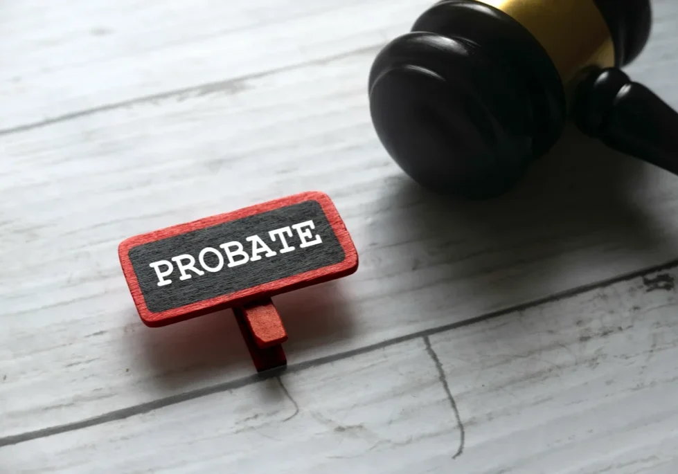 Gavel next to "Probate" sign on table.